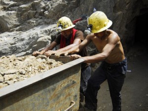 Miners and rescue workers take part in the rescue operation of nine miners trapped at Cabeza de Negro gold-and-copper mine in Ica